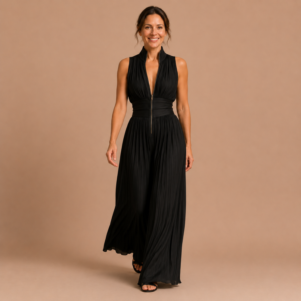 The white Sabina women's jumpsuit draped on a hanger, emphasizing its lightweight feel and airy design.