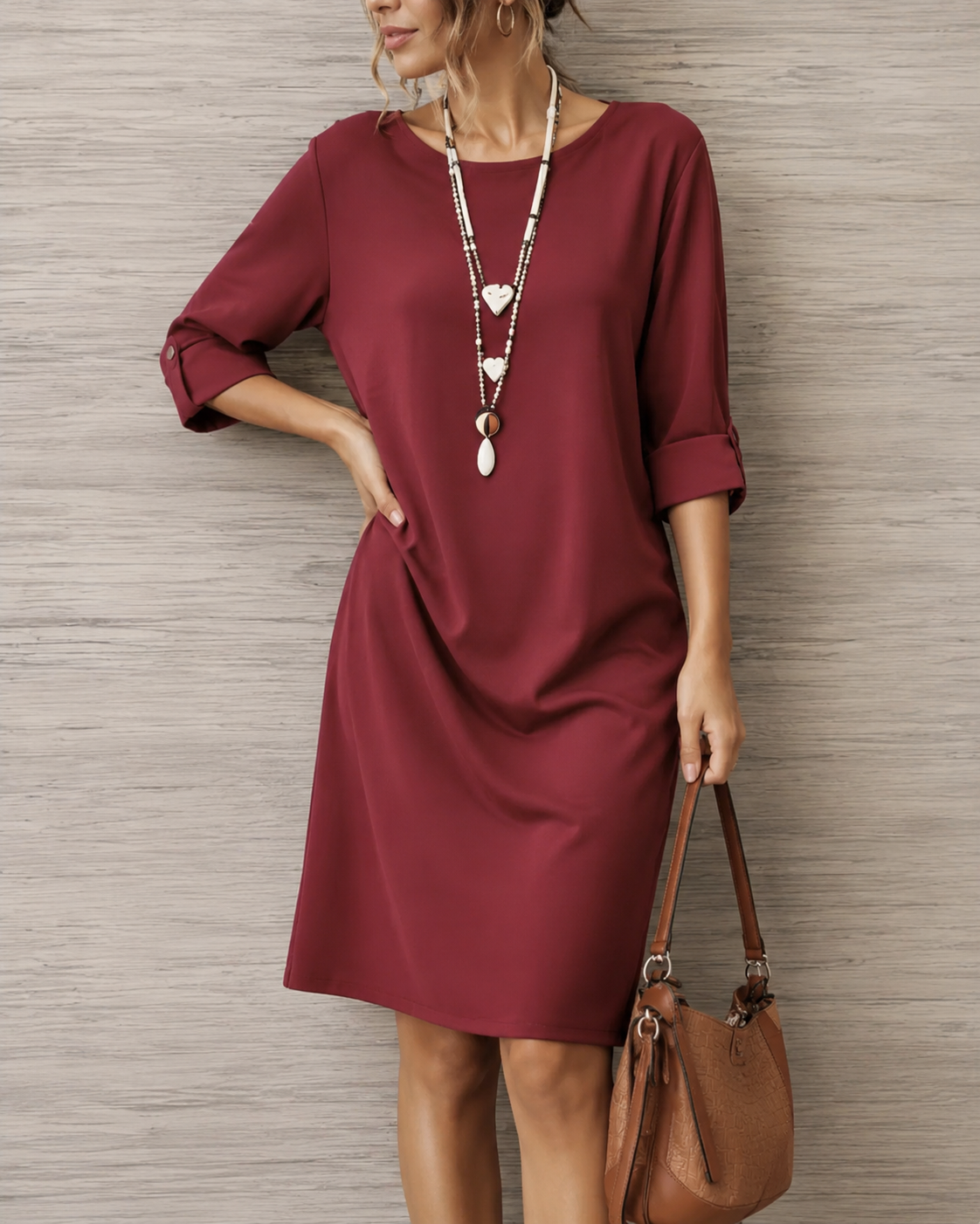 Stylish woman wearing the blue midi dress, posing casually to illustrate its effortless elegance and versatility.
