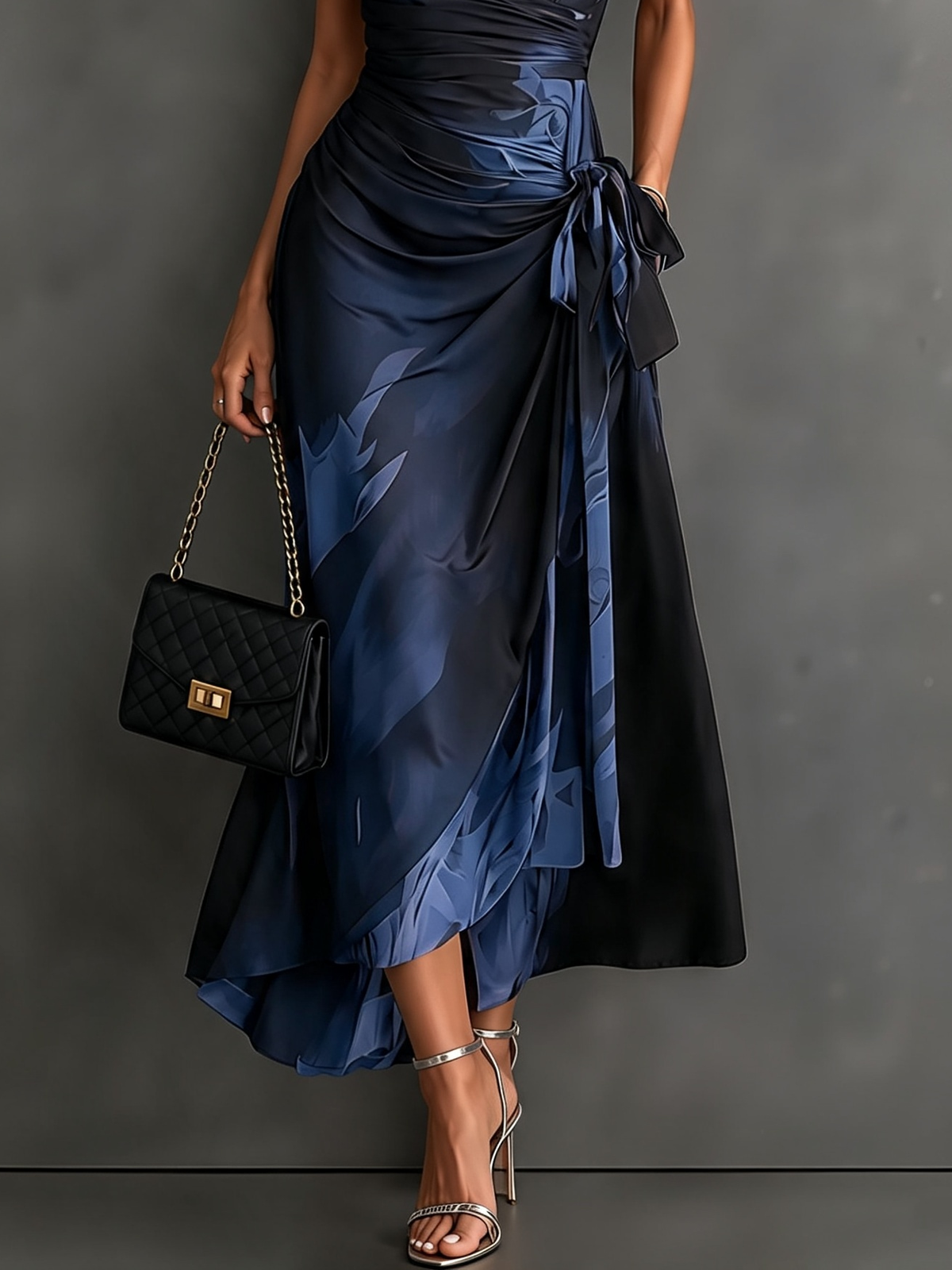 Mirella abstract print maxi dress in black, styled with chic accessories perfect for a dinner date.