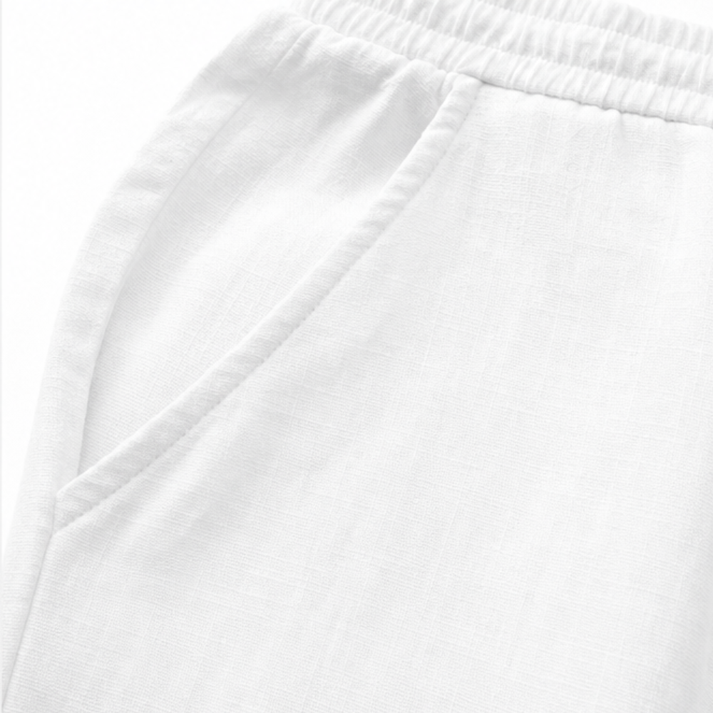Profile view of women's white cotton-linen trousers, detailing the length and side seams.