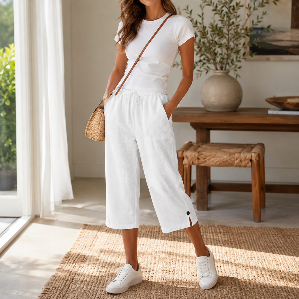 Close-up of breathable cotton-linen fabric on a leg, highlighting comfort of the capri trousers.
