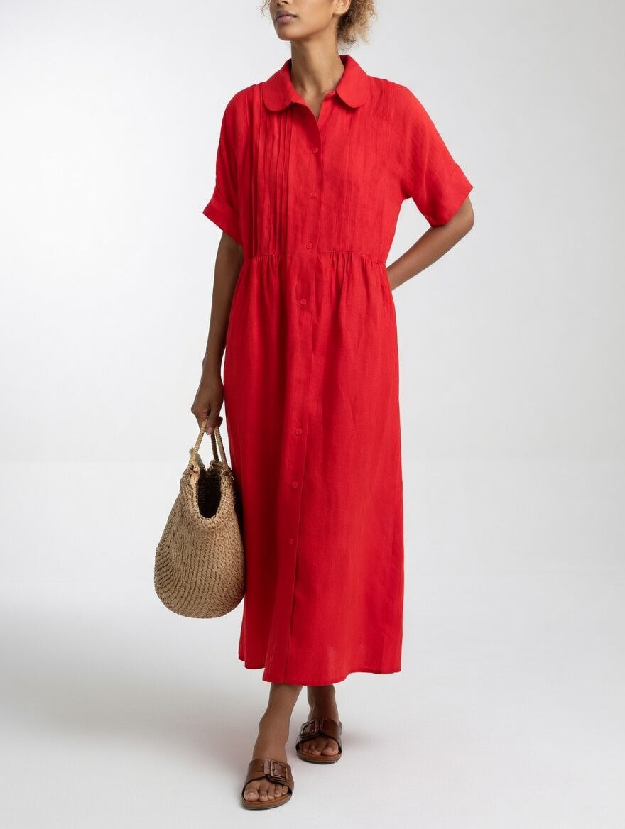 Rear view of the red long shirt dress, illustrating the natural silhouette and graceful drape of the garment.