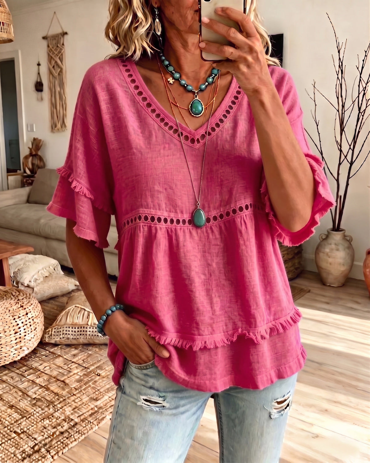 Back view of a lavender purple V-neck blouse, showing the relaxed silhouette perfect for warm-weather wear.