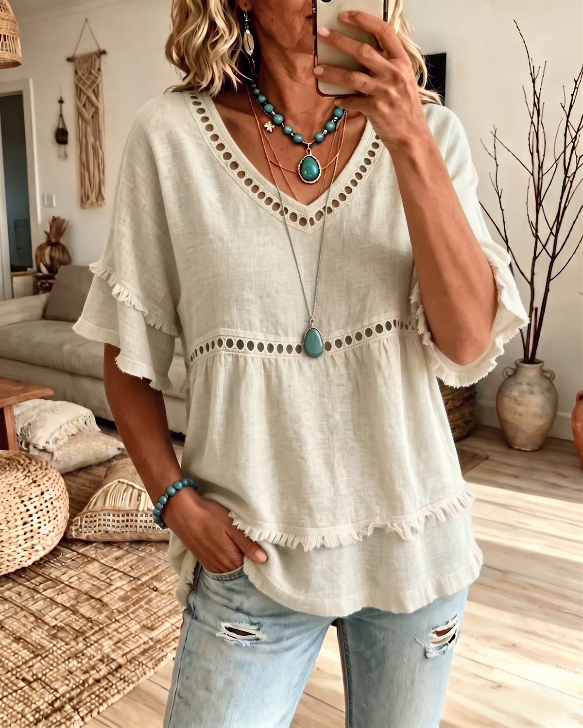 Side profile of the light blue everyday blouse, demonstrating its easy flowing shape and comfortable fit.