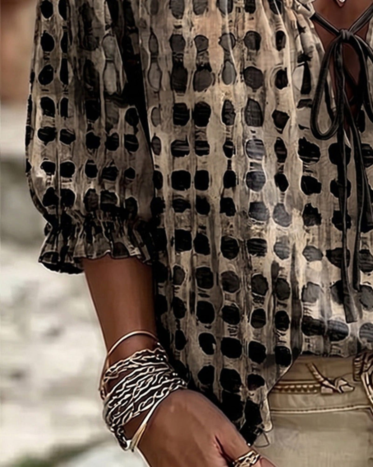 Lilac polka dot blouse, styled with a wide-brimmed hat, exuding a relaxed summer vibe.