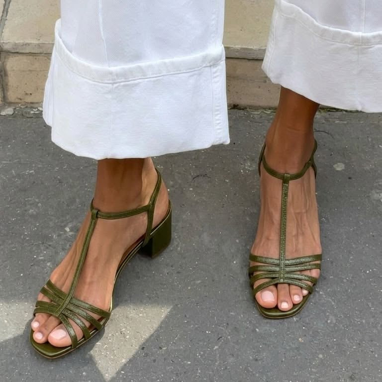 Detail view of the sole and construction of the comfortable Allegra vintage sandals.