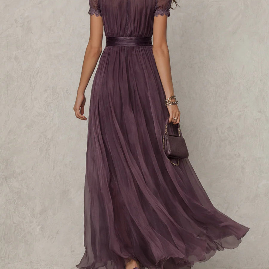 Close-up detail of the keyhole neckline and subtle lace accents on the bodice of the chiffon maxi dress.