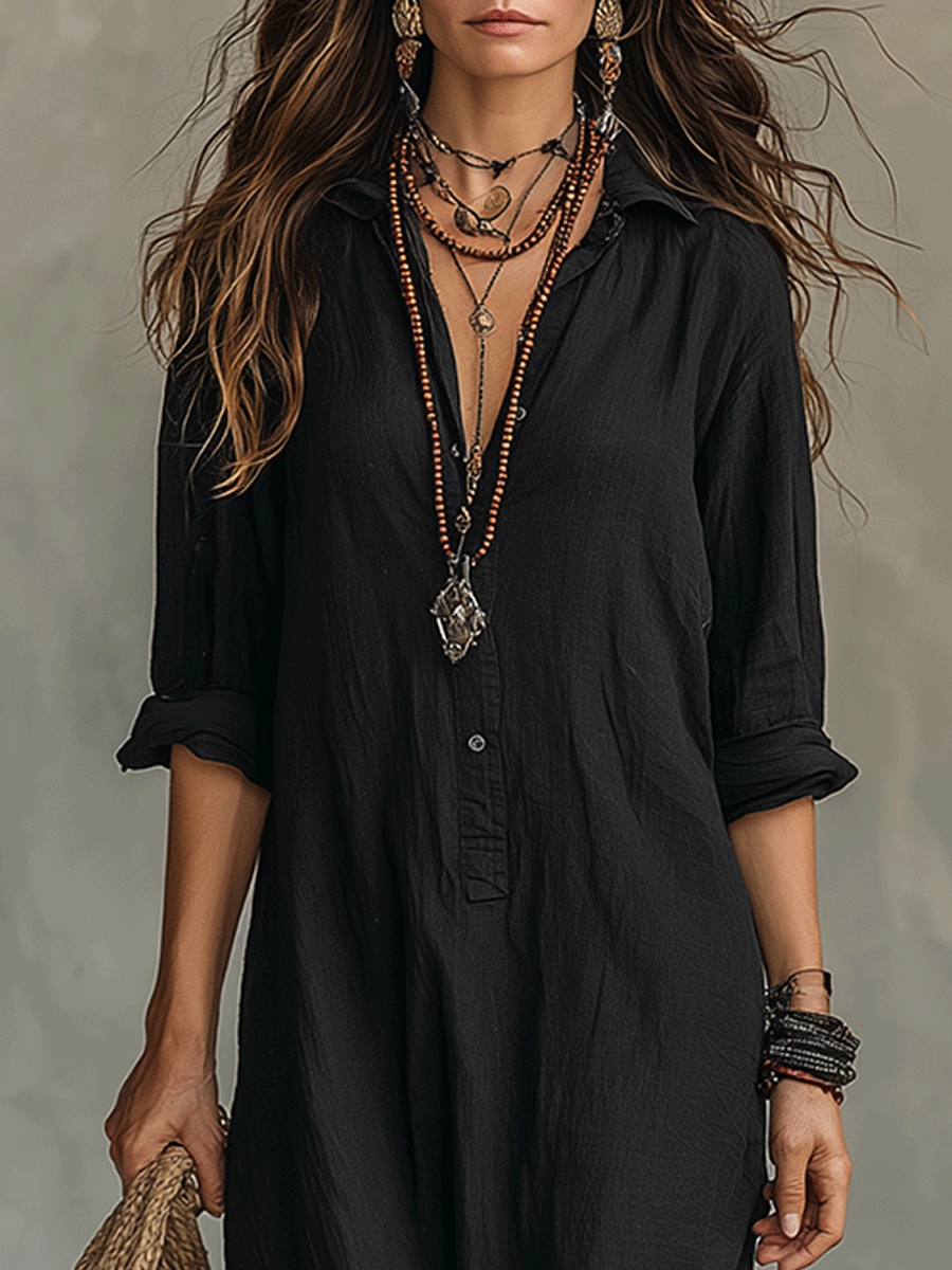 Detail of the neckline and collar area on the green long sleeve maxi dress, showing subtle design elements.