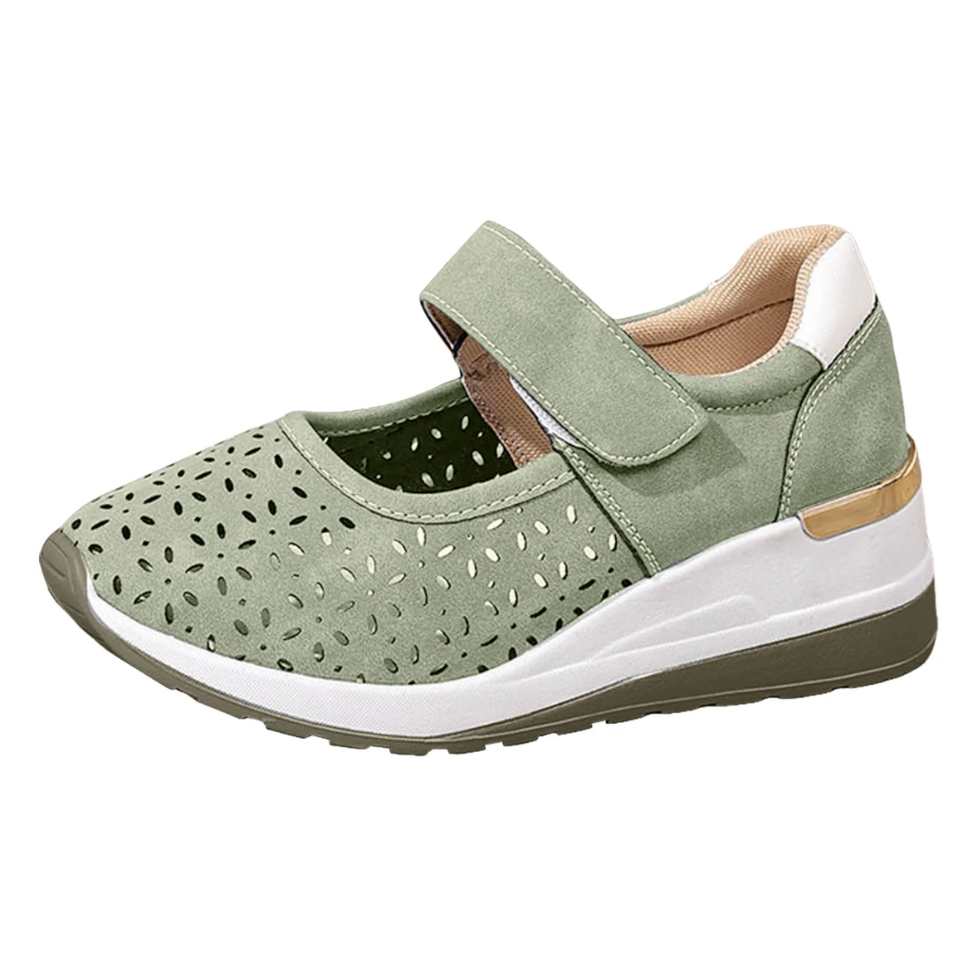 Side view of a pair of Celeste comfort arch support sandals in a light color, showcasing the elevated sole.