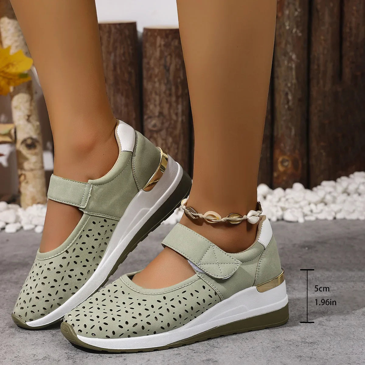 Close-up of the breathable upper material and adjustable Velcro strap on the Celeste sandals, highlighting texture.