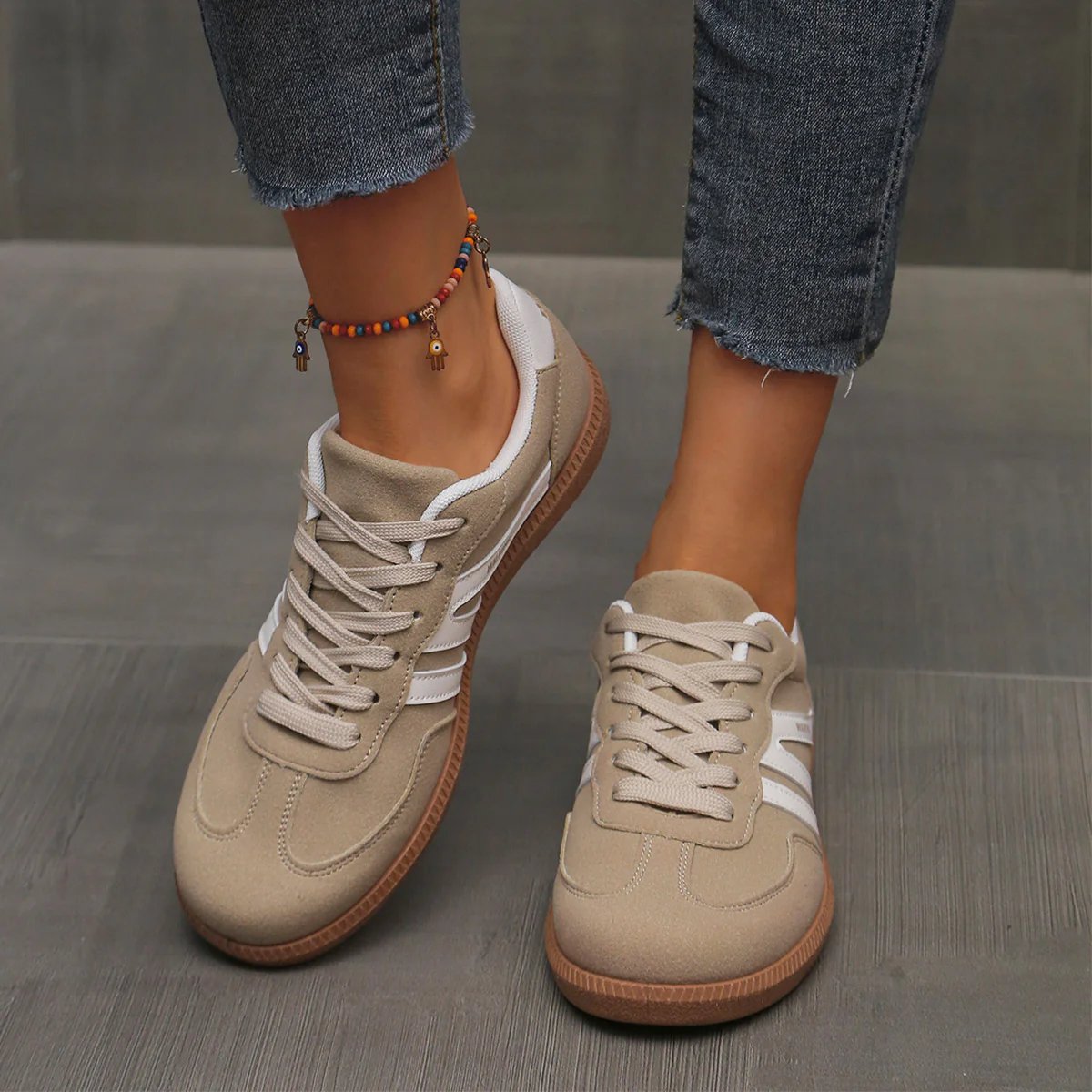 Overhead view of a pair of brown Elara orthopaedic cushioned trainers, highlighting the earthy tone.