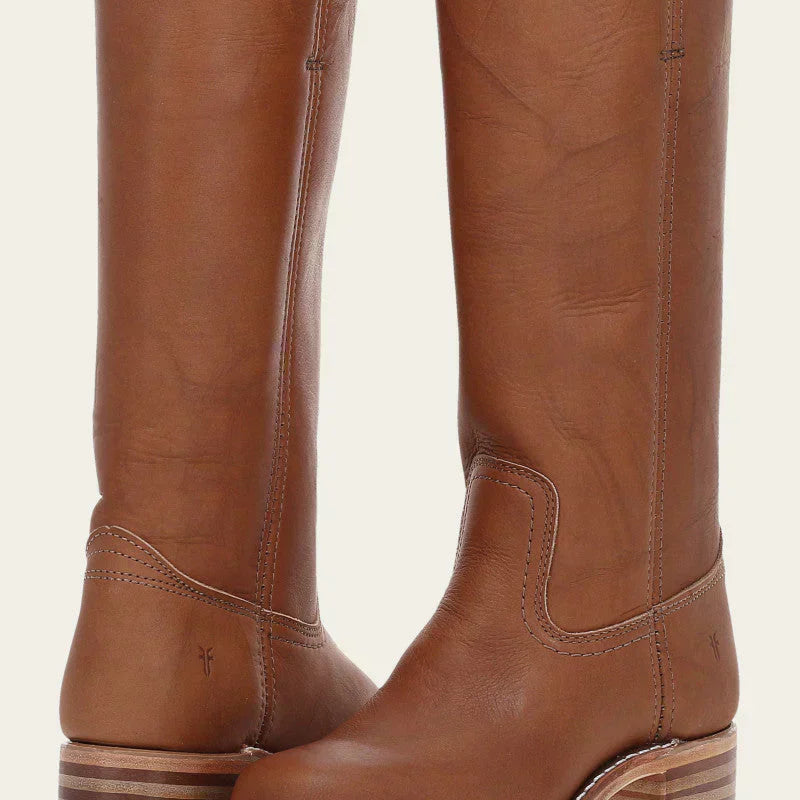 Side profile of the Elara classic Western boots in dark brown, highlighting the stacked block heel and clean lines against a neutral background.
