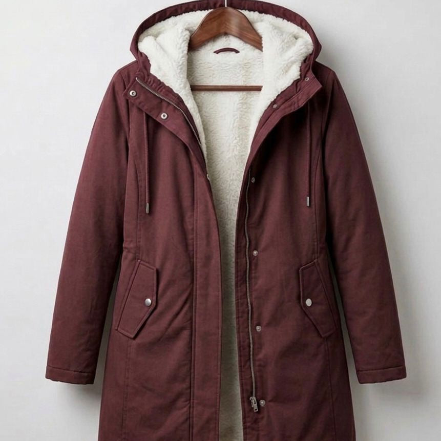 Detail shot of the soft, high-loft fleece lining inside the Elara parka, promising warmth and comfort.