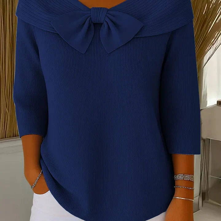 Textured fabric detail of the Elara elegant knitted top in red, showing the quality of the premium soft knit material.