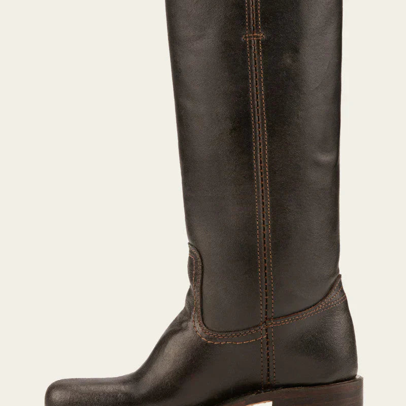 Elara classic Western boots in black on a model's feet, paired with a flowing dress, demonstrating versatile styling.