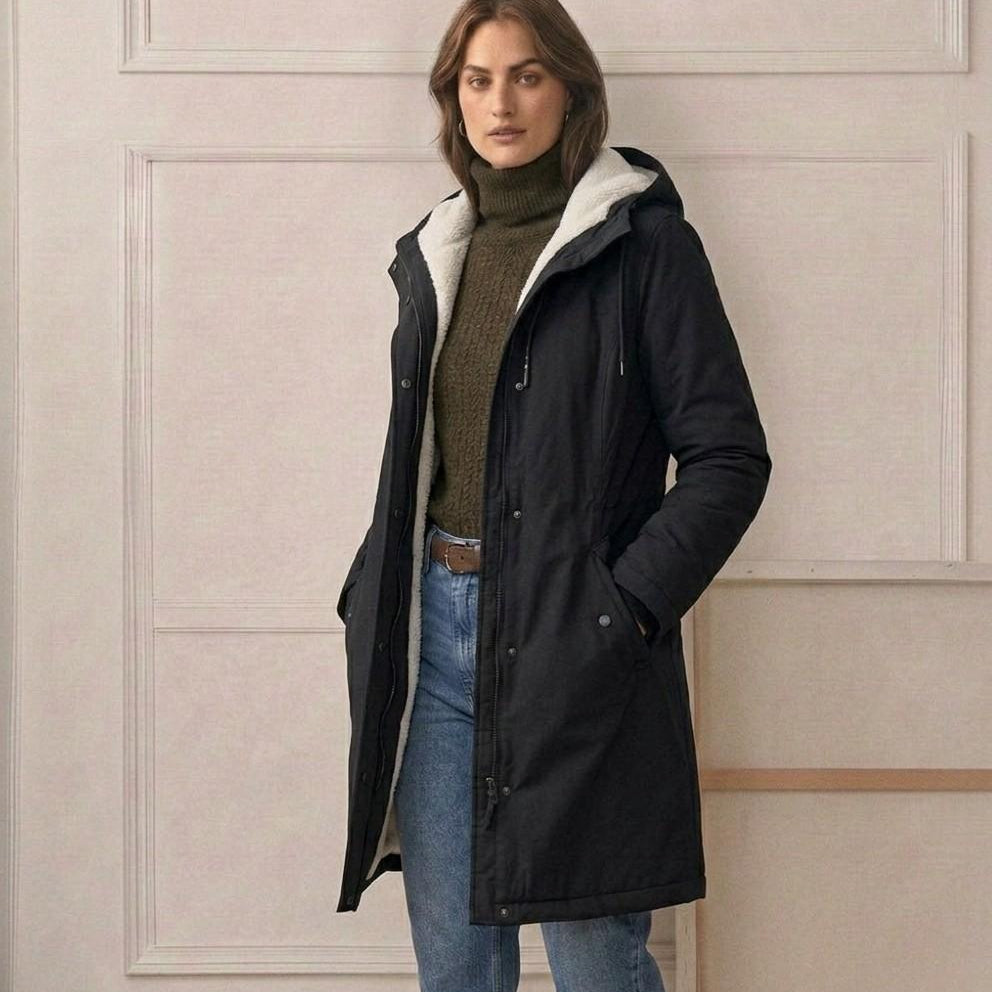 Open view of the Elara parka, revealing the contrast between the waterproof shell and the plush interior.