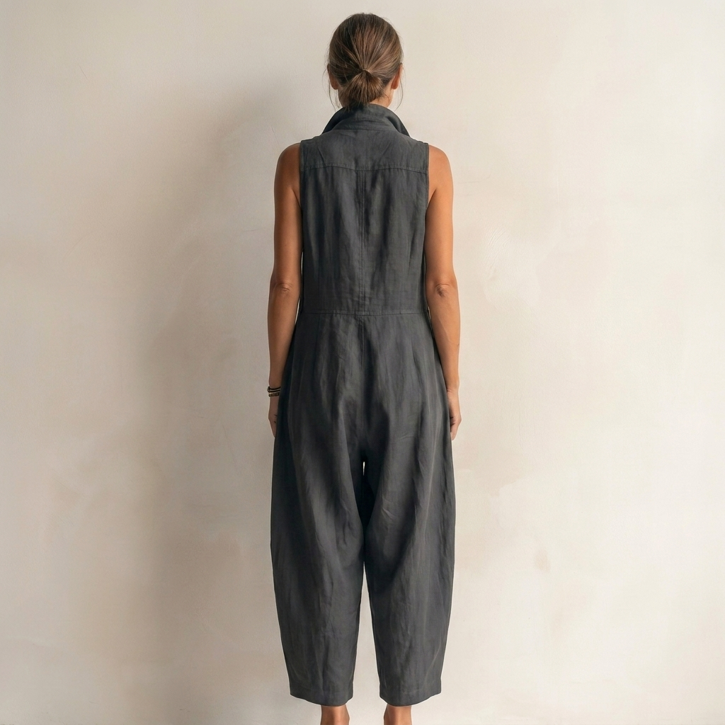 Close-up detail of the partial button placket and stand-up collar on the versatile sleeveless jumpsuit.