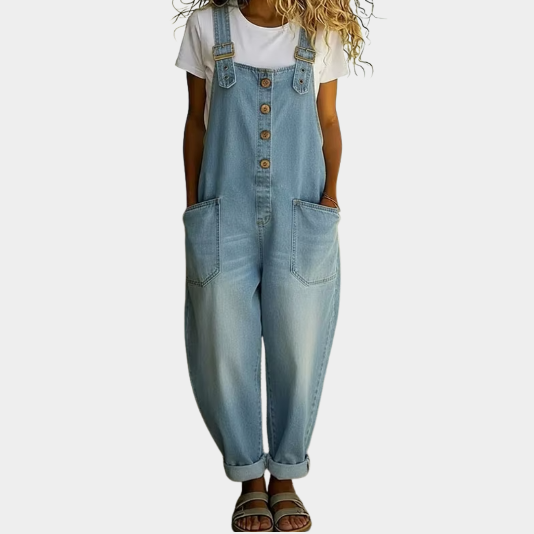 Front view of Juniper soft denim overalls in light blue, showcasing adjustable straps and a relaxed wide-leg silhouette.