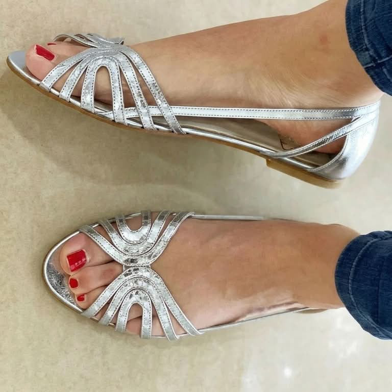 Close-up of the golden detail on a Kaelen vintage sandal, emphasizing the luminous finish and craftsmanship.