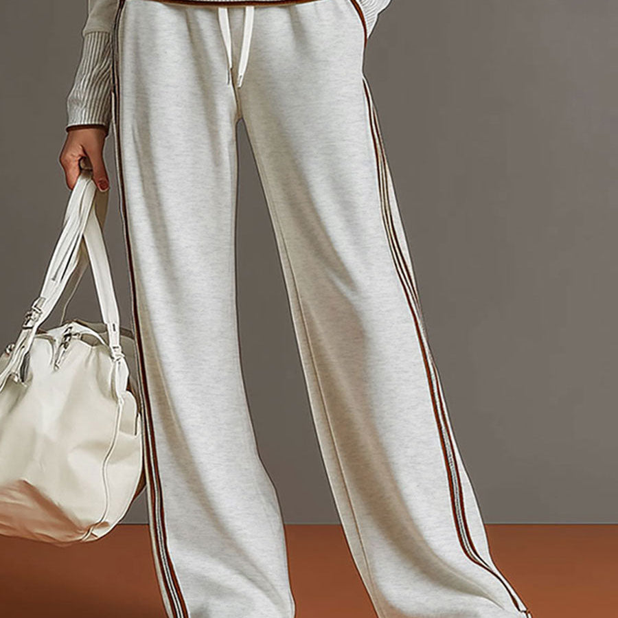Another full-body shot of the woman from a different angle, emphasizing the flattering silhouette of the wide-leg pants.