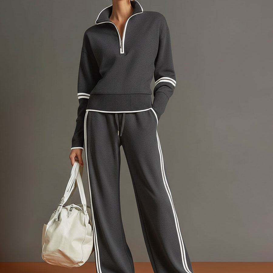 Back view of the woman wearing the elegant wide-leg pants, highlighting the drape and silhouette.