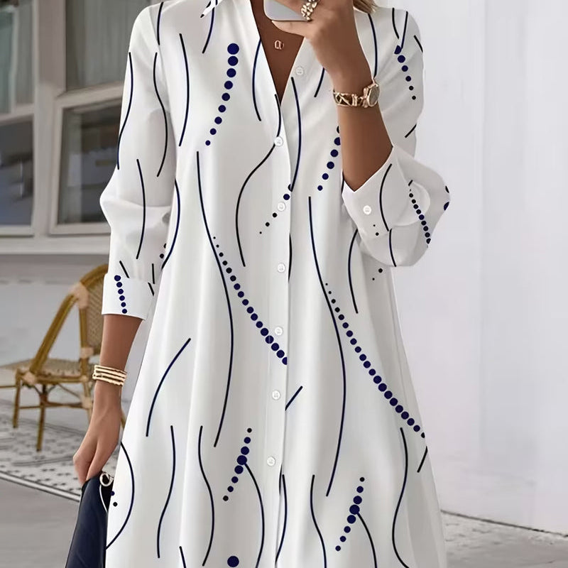 Back view of the Kora A-line dress, showing the full length and the subtle drape of the wavy stripe garment.
