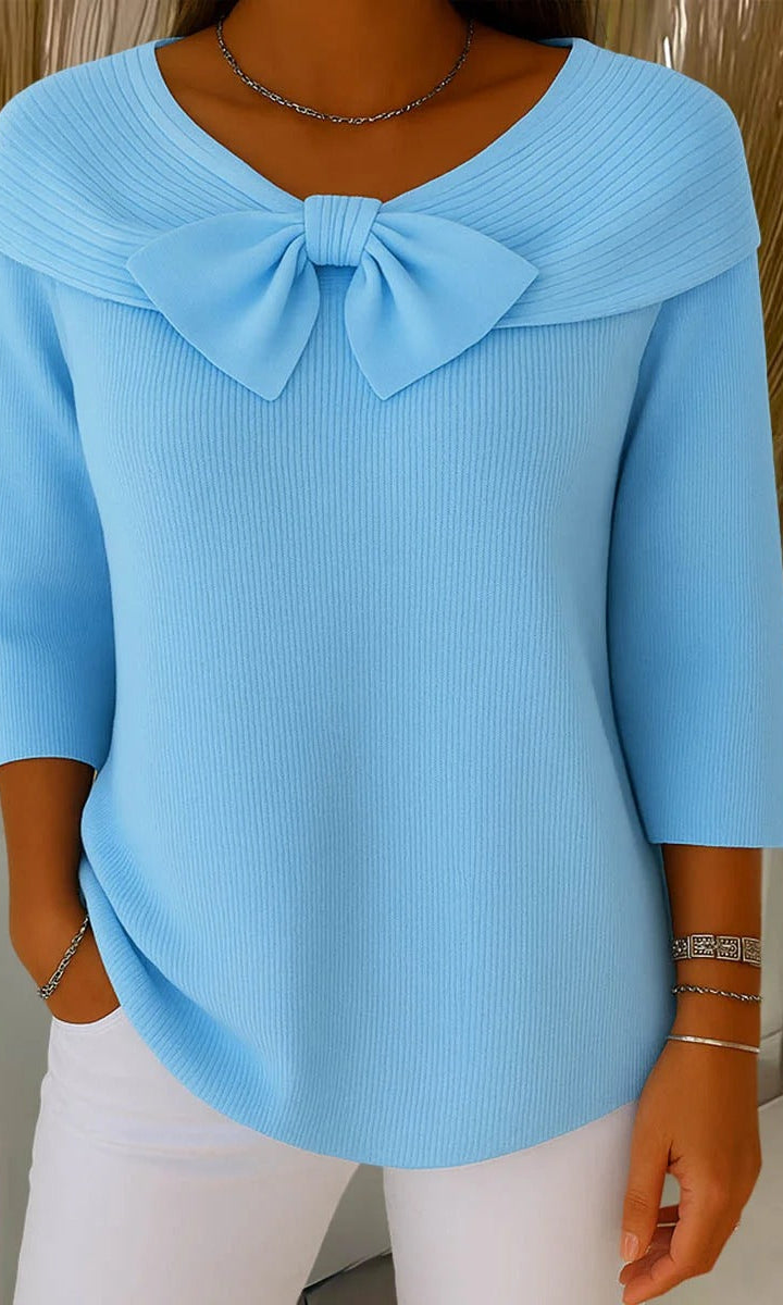 Front view of the Lana elegant knit tunic in a soft blue color, showcasing its loose fit and rounded neckline.