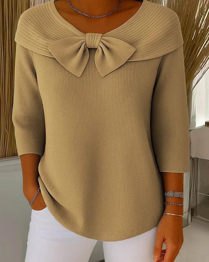 Close-up detail of the fine knit texture on the Lana tunic, showing the quality of the garment.