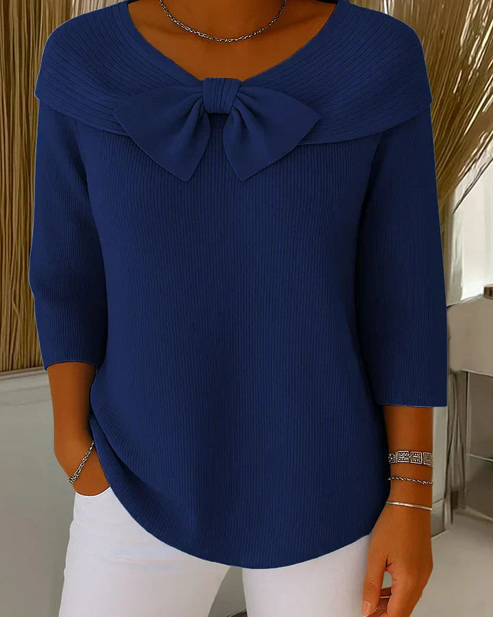 Model wearing the Lana elegant knit tunic in a khaki shade, styled casually for a relaxed look.