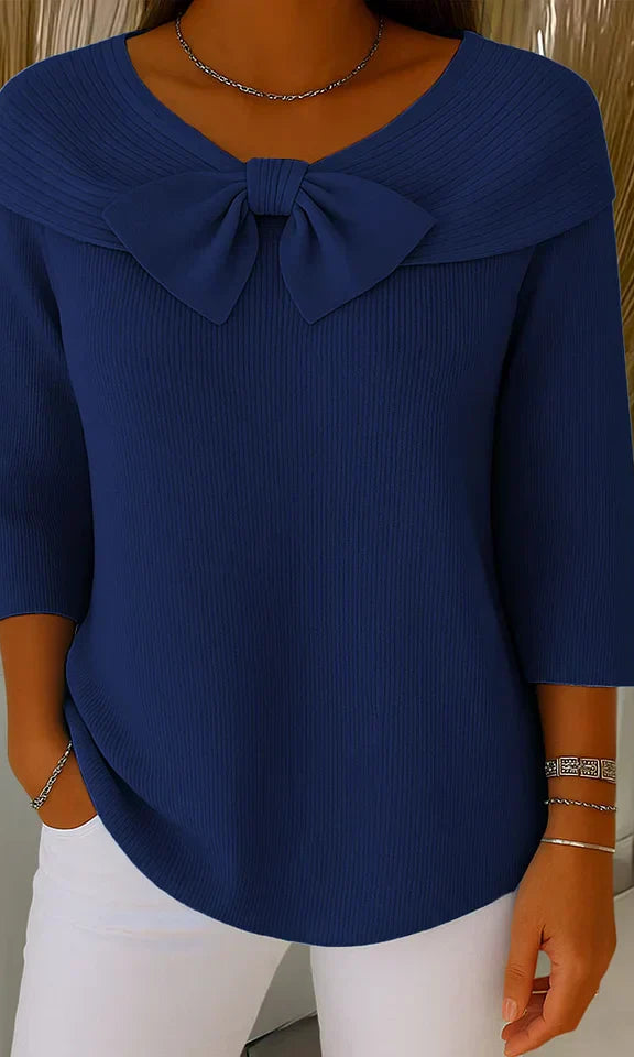 Model wearing the Lana elegant knit tunic in a khaki shade, styled casually for a relaxed look.