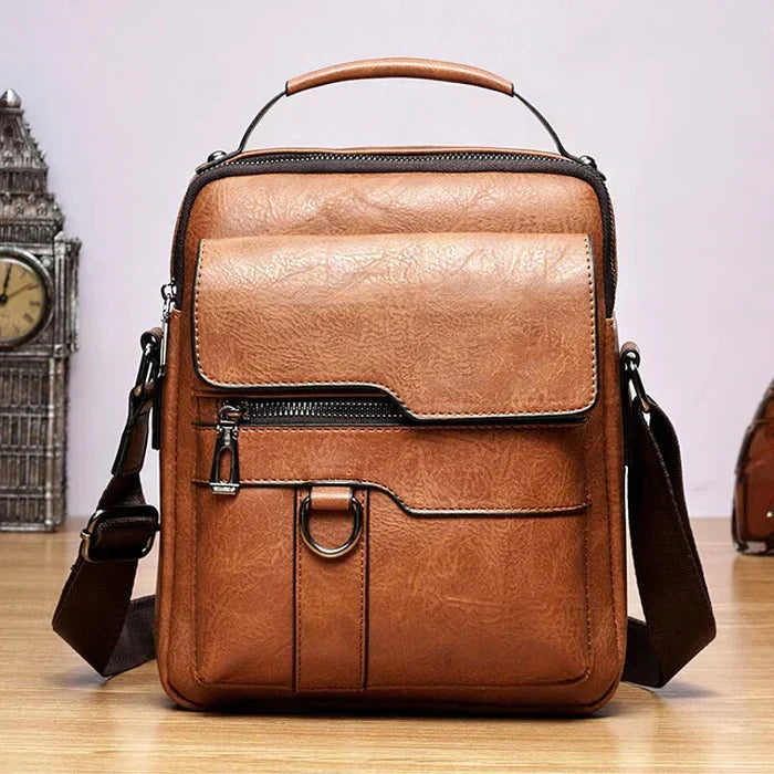 Milo modern shoulder bag in black, with the flap slightly open, revealing the practical and spacious interior layout.