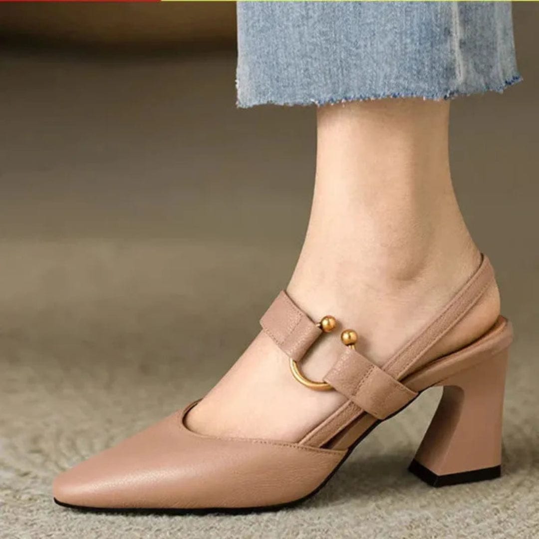 Pair of black slingback heels displayed next to dark wash jeans, illustrating versatile styling options for everyday wear.
