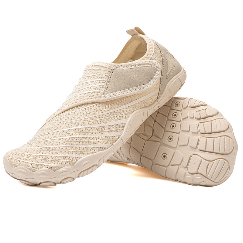 Mono Stripe Maeve comfort orthopedic shoes, worn by a person walking on a path.