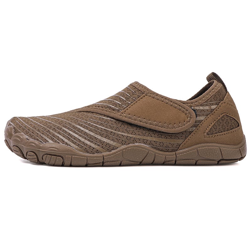 White Maeve comfort orthopedic shoes, demonstrating flexibility when bent slightly.