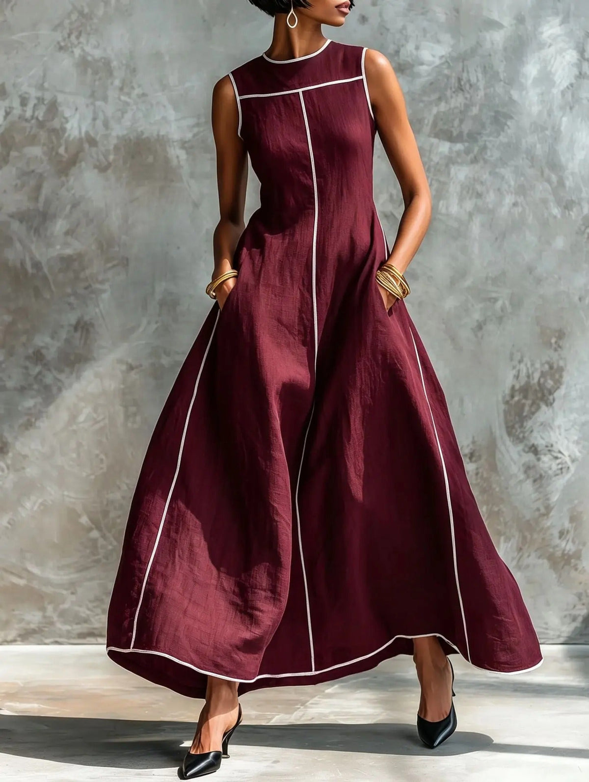 Back view of a black sleeveless maxi dress, revealing the subtle keyhole detail at the high round neckline.