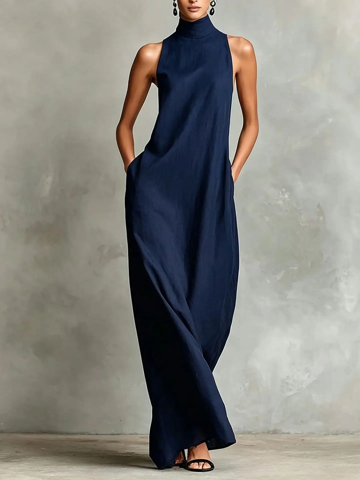 Detail of the light, breathable fabric texture on a pink sleeveless maxi dress, perfect for warm days.