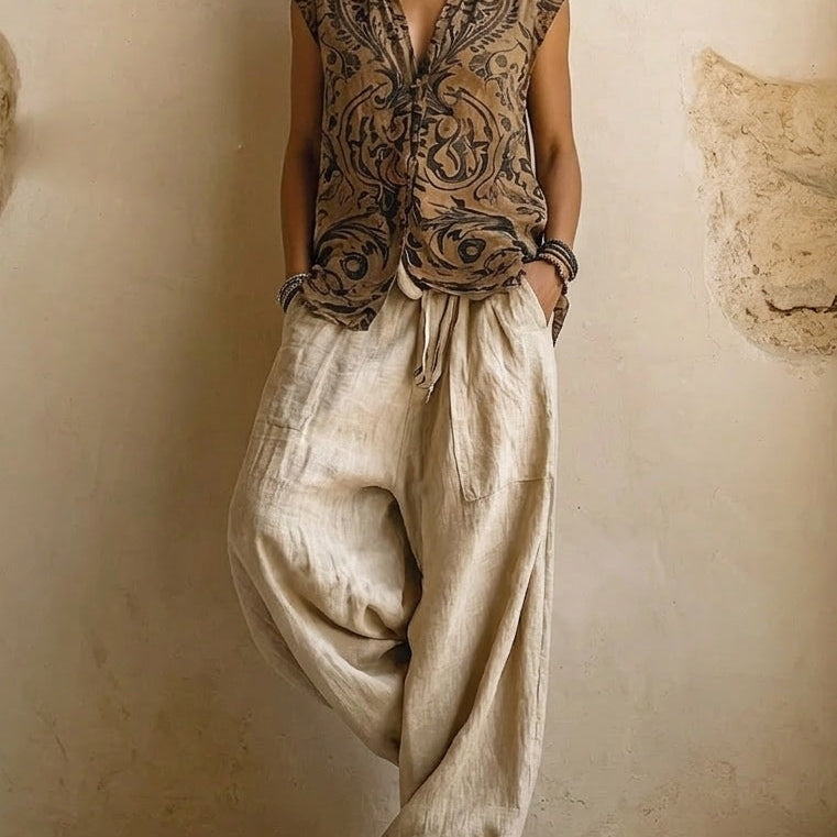 Side profile of a woman showcasing the flowy wide-leg design of the natural relaxed fit pants in a casual setting.
