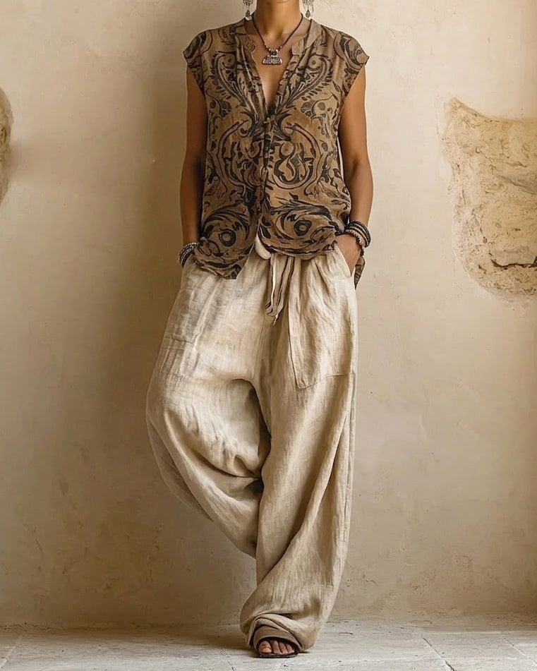 Side profile of a woman showcasing the flowy wide-leg design of the natural relaxed fit pants in a casual setting.