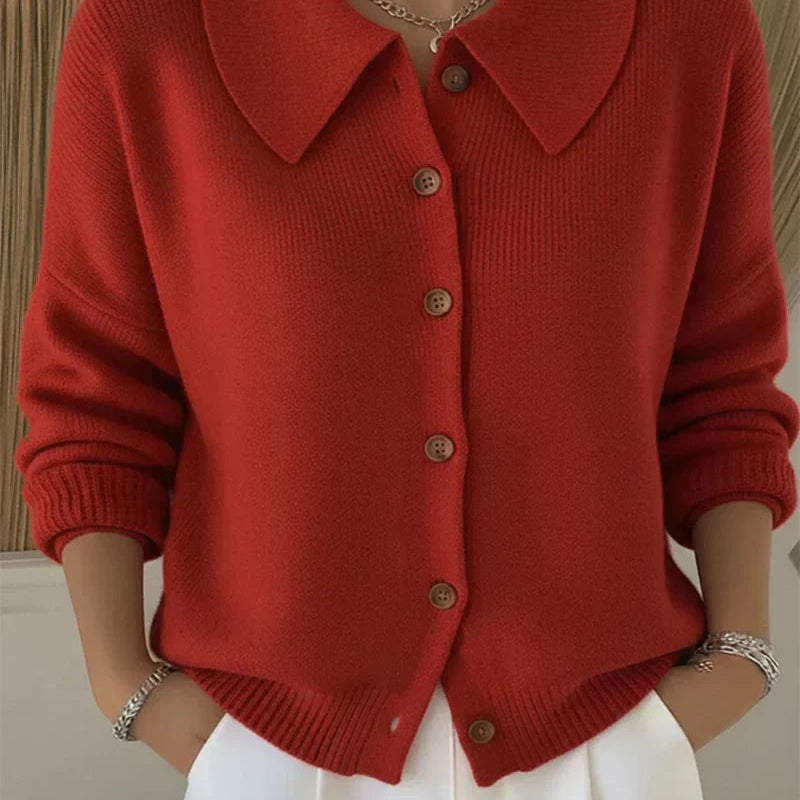 Side profile of the Marlow loose-fit cardigan, highlighting its relaxed drape and smooth texture.