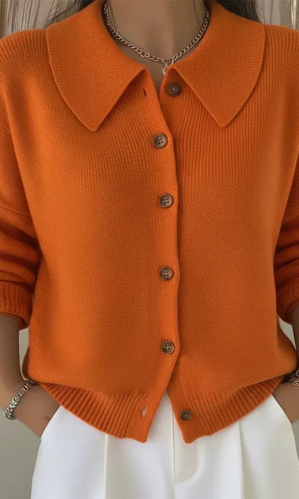 Close-up detail of the classic button closure on the front of the Marlow everyday cardigan.