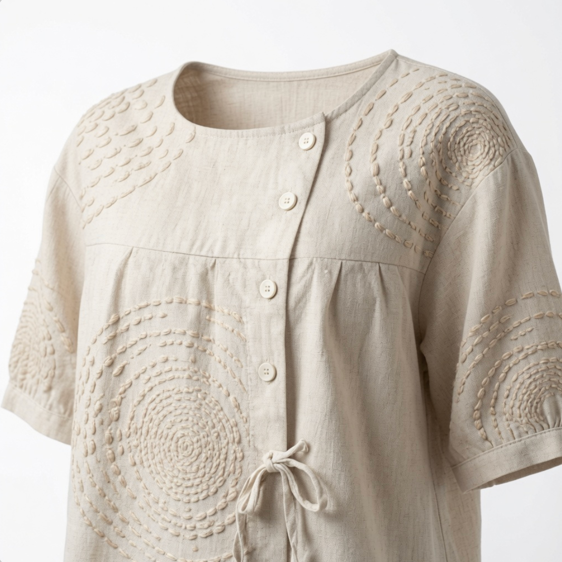 Rear view of the relaxed-fit Mirabelle embroidered top, demonstrating its comfortable silhouette.