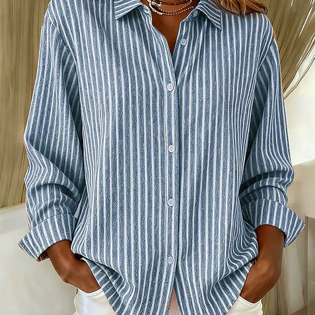 Front view of a blue Nina relaxed fit shirt with vertical stripes, showcasing its loose drape.