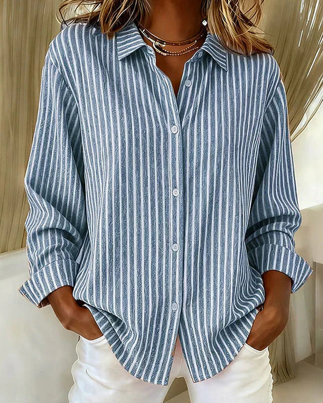 Front view of a blue Nina relaxed fit shirt with vertical stripes, showcasing its loose drape.