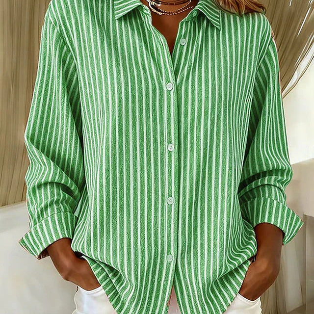 Side profile of a woman wearing the blue Nina relaxed fit shirt, highlighting the long sleeves.