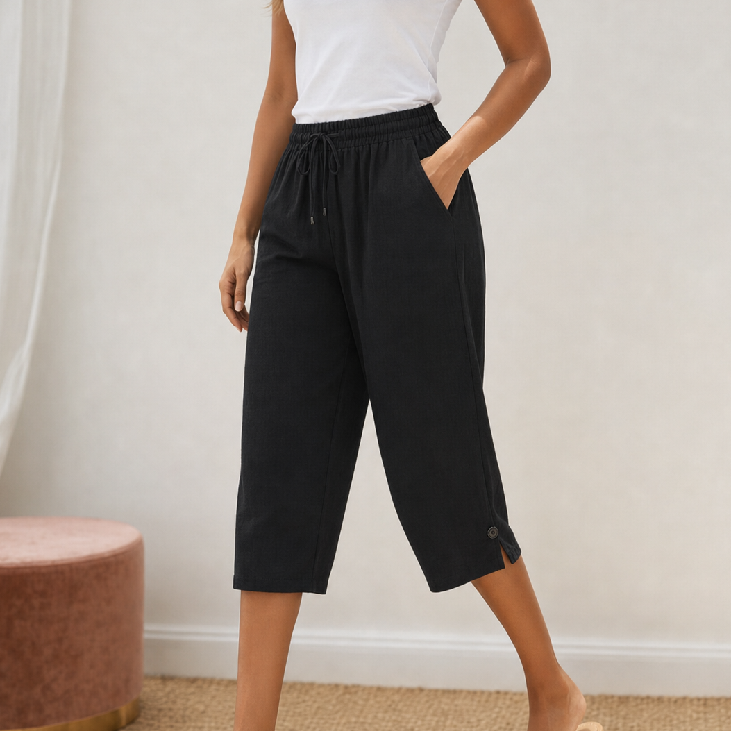 Folded white cotton-linen capri trousers, ready to be worn right out of the package.