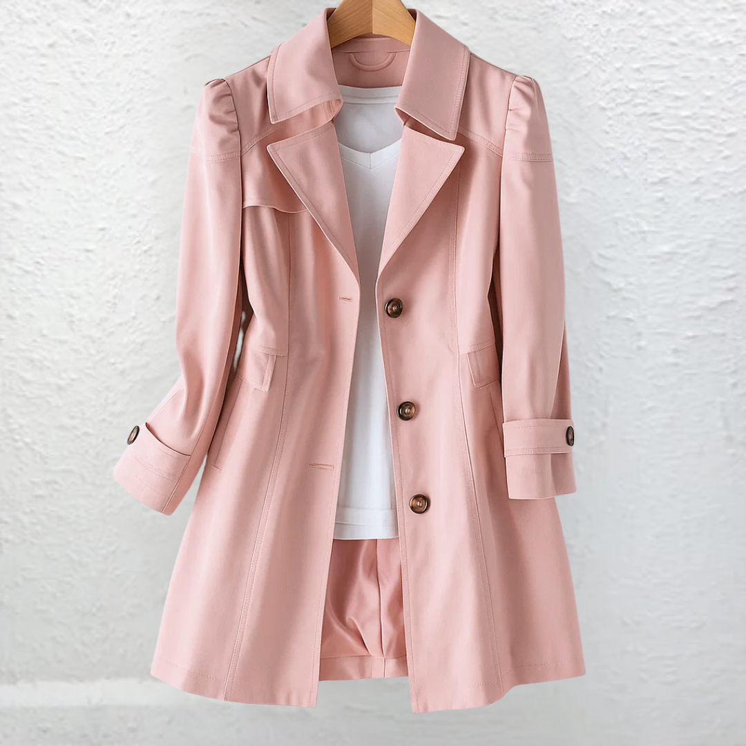 A woman confidently walking outdoors wearing the Renata summer trench coat in khaki, showcasing its relaxed silhouette.