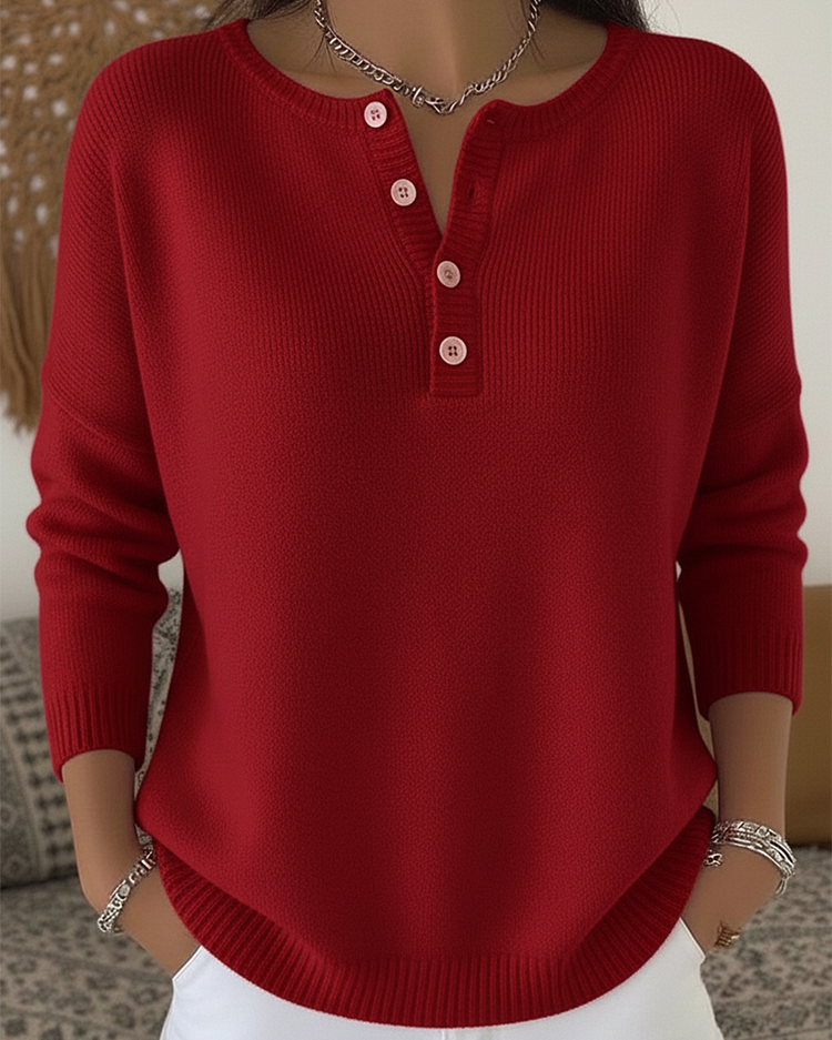 Front view of Romy comfort button-up pants in a neutral shade, showing the loose fit and button details.