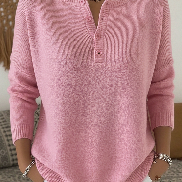 Close-up detail of the button-up closure on the Romy comfort pants, showcasing the subtle elegance.