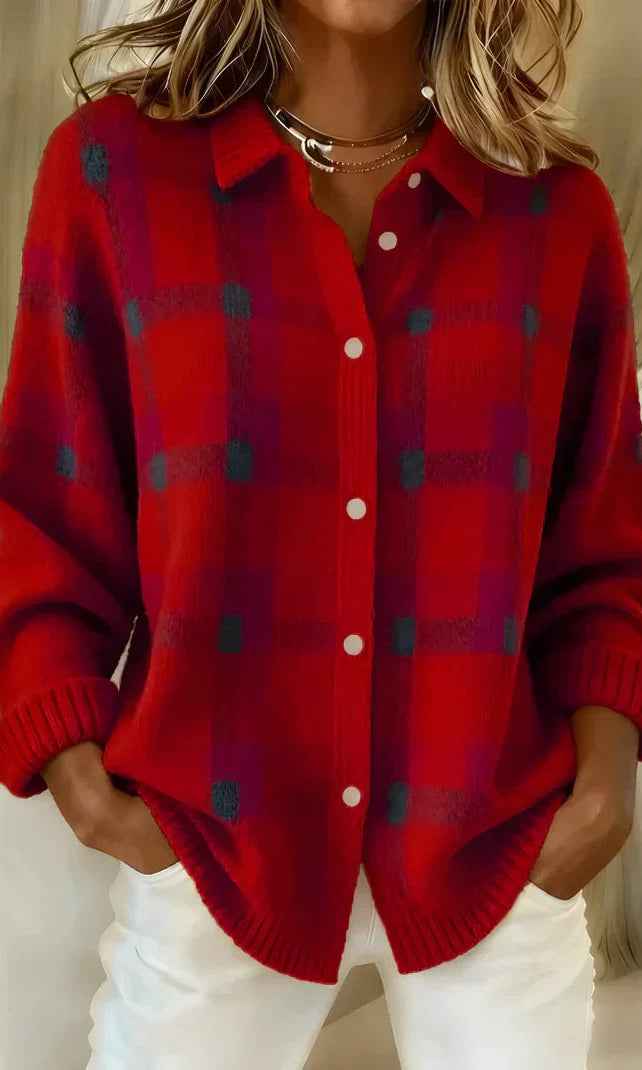 Side profile of a woman wearing the orange Sable relaxed fit cardigan, showcasing its loose drape.