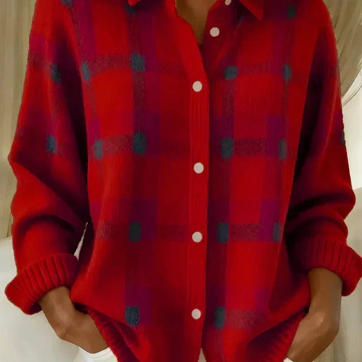 Side profile of a woman wearing the orange Sable relaxed fit cardigan, showcasing its loose drape.